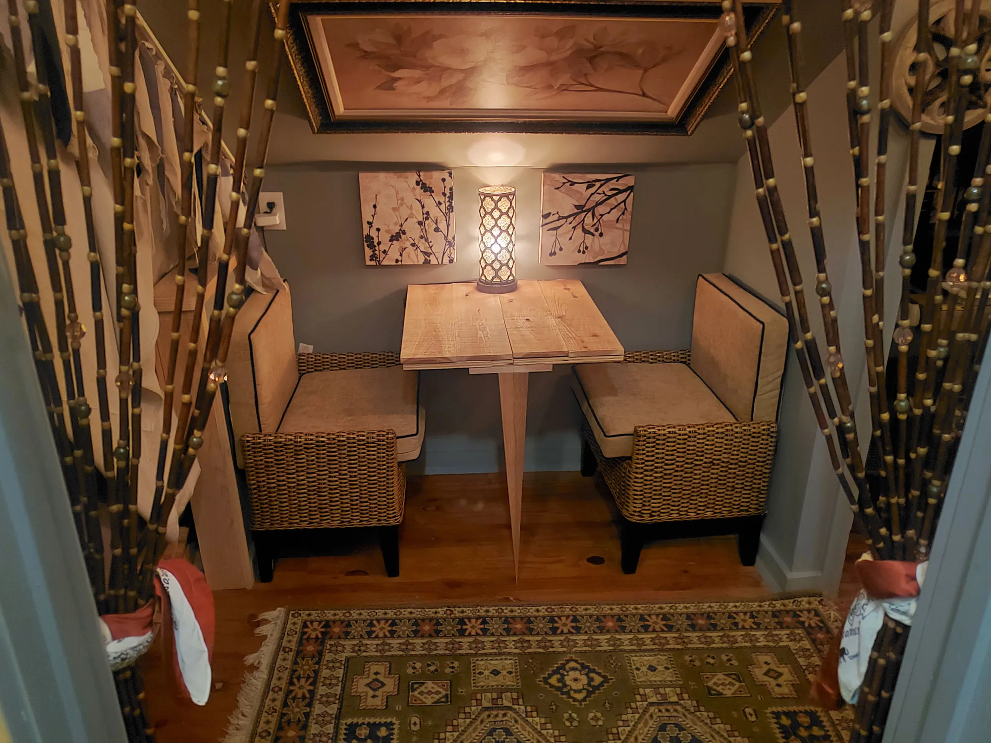 A quiet interior nook with a small table, suited to focused work